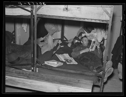 Lumberjacks resting in bunkhouse at logging camp near Effie, Minnesota