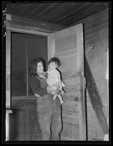 Children of Mexican beet worker. East Grand Forks, Minnesota. Mother is dead and this young girl works in the field and does the housework