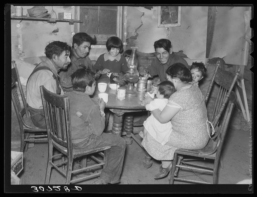 Mexican beet worker family having coffee after a day's work. East Grand Forks, Minnesota