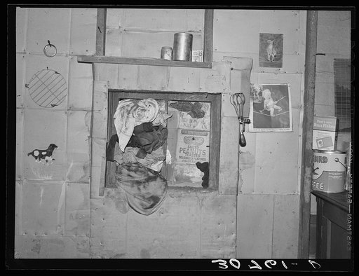 Window in kitchen of house, Williams County, North Dakota. During dust storms in this area, windows have to be stuffed in this manner