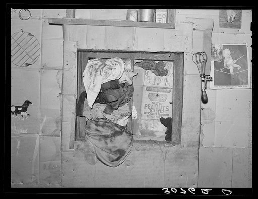 Untitled photo, possibly related to: Window in kitchen of house, Williams County, North Dakota. During dust storms in this area, windows have to be stuffed in this manner