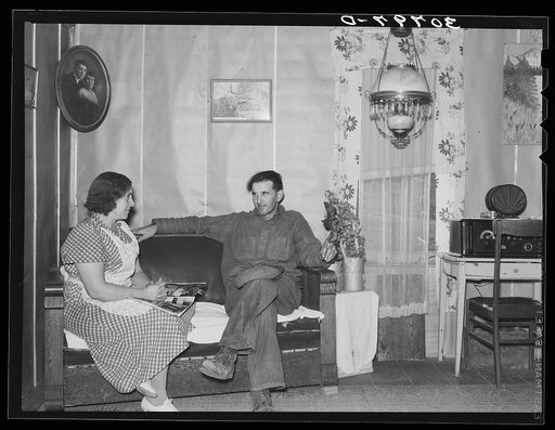 Parents talking over problems in one of the better homes. Williams County, North Dakota