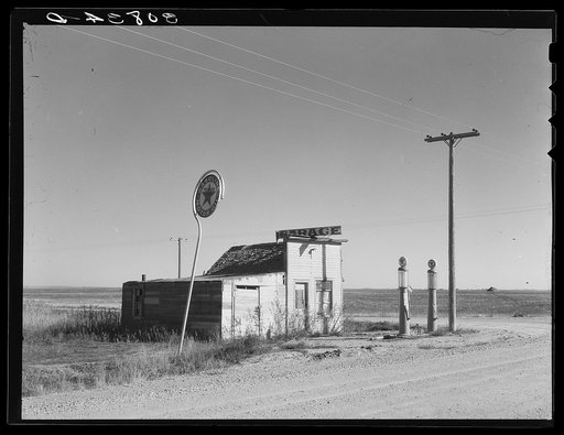 Abandoned garage on Highway Number 2. Western North Dakota