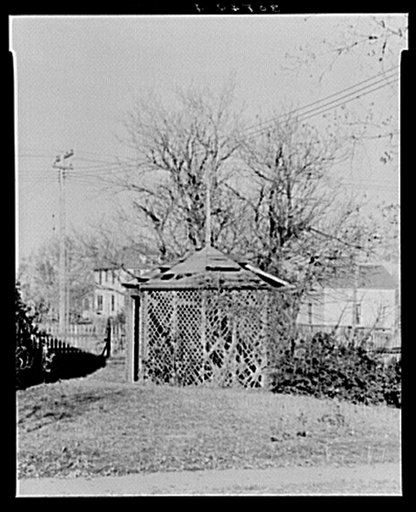 Outdoor summer pergola dining room in yard. Towner, North Dakota
