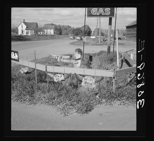 Signs in service station. Larimore, North Dakota