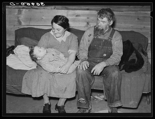 Mr. and Mrs. Harshenberger [i.e. Harshbarger] and baby. Mennonite farmers near Antelope, Montana