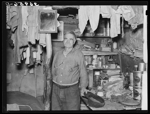 Elmer "Hominy" Thompson in his shack home. Sheridan County, Montana
