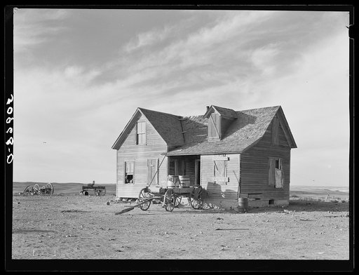 Farmhouse and wagon used for hauling water. Sheridan County, Montana