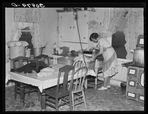 Wife of Carl Thorson, former farmer, doing the washing. Crosby, North Dakota