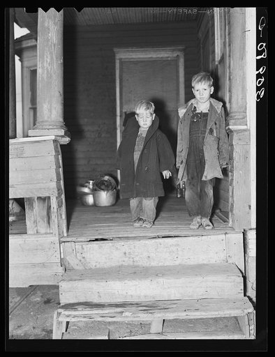 Two children of Carl Thorson on porch of home. Crosby, North Dakota