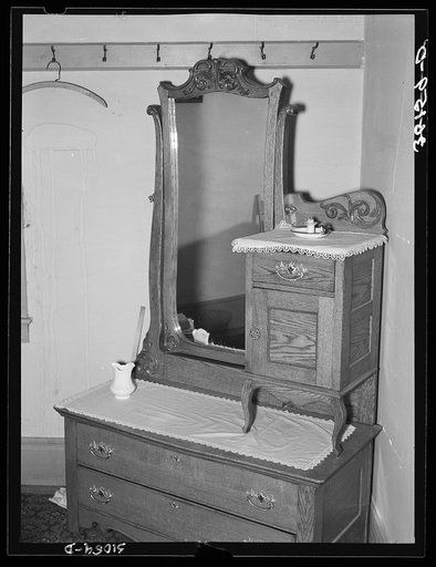 Old dresser in home of Jim Hardin, former promoter. Two Bit Creek, near Deadwood, South Dakota