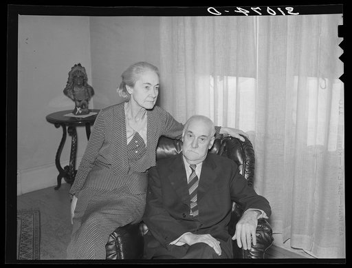 Untitled photo, possibly related to: Mr. and Mrs. Jim Hardin in home. Two Bit Creek, near Deadwood, South Dakota. Hardin was once a wealthy mining promoter, is now on relief.