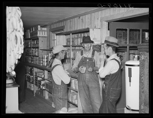 Southeast Missouri Farms. Farmers talking together in cooperative store. La Forge project, Missouri