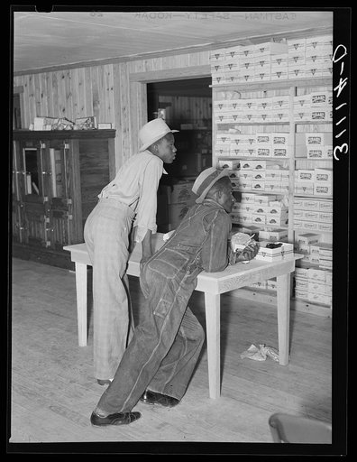 Southeast Missouri Farms. Negro boys waiting to be waited on. Cooperative store at La Forge project, Missouri