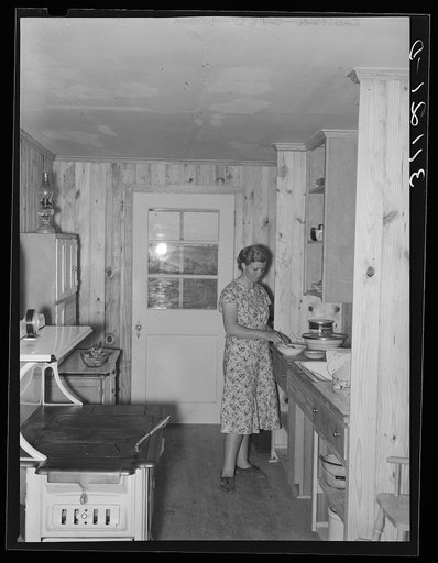 Southeast Missouri Farms. Sharecropper's wife in kitchen of new home. La Forge project, Missouri