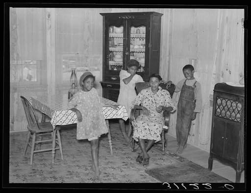 Southeast Missouri Farms. Sharecropper family resettled in new home. La Forge, Missouri
