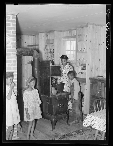 Southeast Missouri Farms. Sharecropper family in new home. La Forge project, Missouri