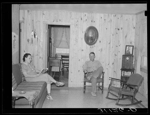Southeast Missouri Farms. Client and wife in living room of new home on La Forge project, Missouri