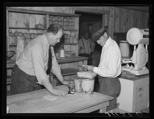 Southeast Missouri Farms. Making a sale. Cooperative store, La Forge project, Missouri