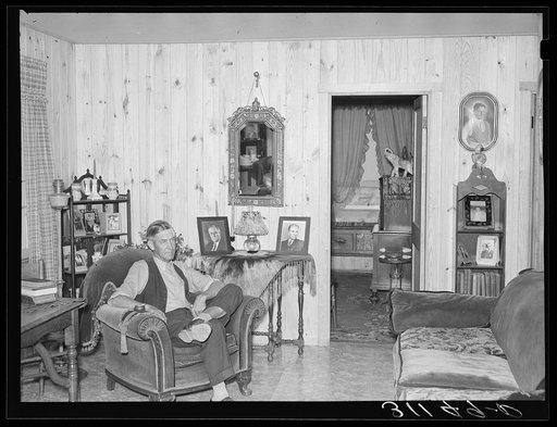 Southeast Missouri Farms. President of La Forge, Missouri cooperative association in living room of home on new farm unit. La Forge project, Missouri