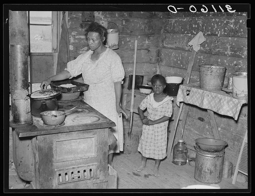 Southeast Missouri Farms. Kitchen in shack from which client will be moved. La Forge project, Missouri