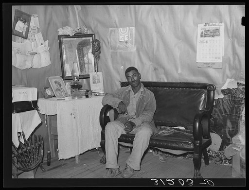 Southeast Missouri Farms. FSA (Farm Security Administration) client, former sharecropper, in living room of cabin home
