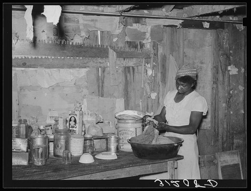 Untitled photo, possibly related to: Southeast Missouri Farms. Sharecropper wife preparing midday meal