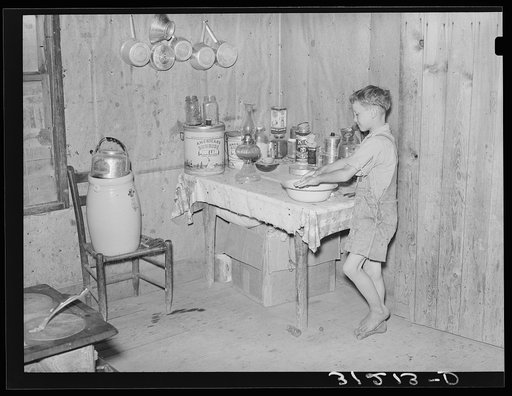 Southeast Missouri Farms. Son of sharecropper washing hands