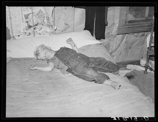 Southeast Missouri Farms. Sharecropper's child asleep on bed