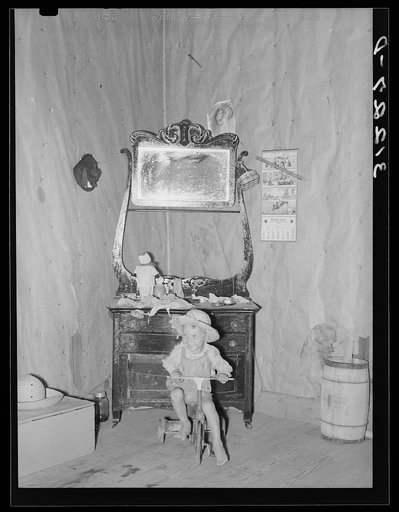 Southeast Missouri Farms. Son of sharecropper in bedroom of shack home