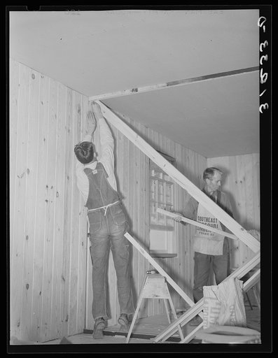 Untitled photo, possibly related to: Southeast Missouri project field. House erection. Diagonal wind bracing is placed in every interior partition in the house