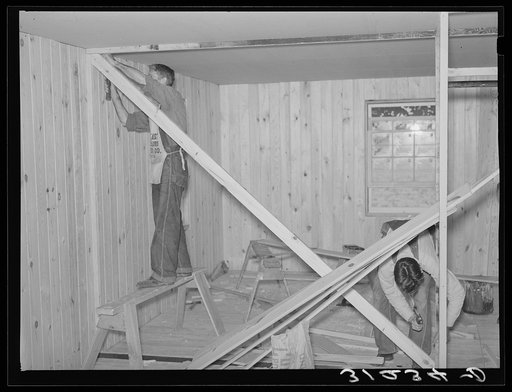 Southeast Missouri project field. House erection. Diagonal wind bracing is placed in every interior partition in the house