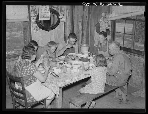 Sharecropper's family at midday meal. Southeast Missouri Farms