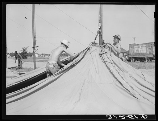 Members of carnival crew erecting tent. Lasses-White traveling show. Sikeston, Missouri