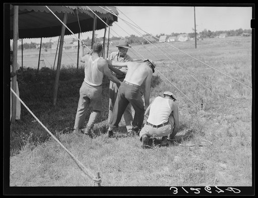Pulling ropes for attachment to stakes. Lasses-White show. Sikeston, Missouri