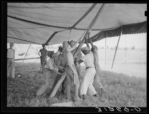 Placing pole of tent. Lasses-White show. Sikeston, Missouri
