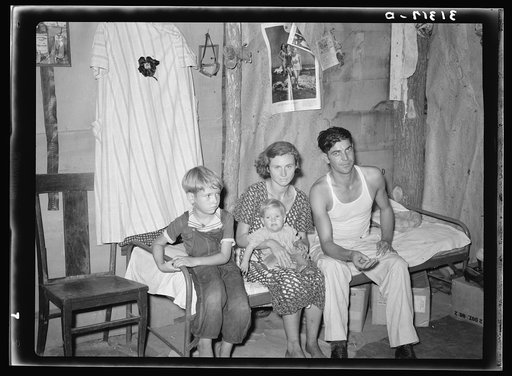 Family living in Tin Town, Caruthersville, Missouri, between the levee and the river