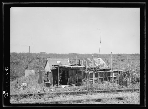 Shack on the other side of the railroad tracts, looking toward the levee. Tin Town, Caruthersville, Missouri
