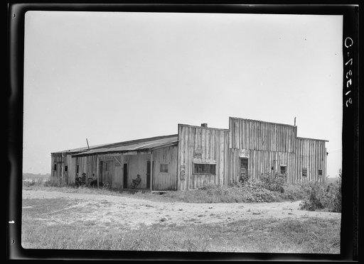 Old warehouse, once the station for early Mississippi River steamboat travel, Caruthersville, Missouri, now inhabited by squatters
