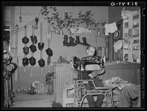 Shoemaker in his shop. Kenner, Louisiana