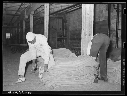 Sewing burlap sacks. State rice mill, Crowley, Louisiana