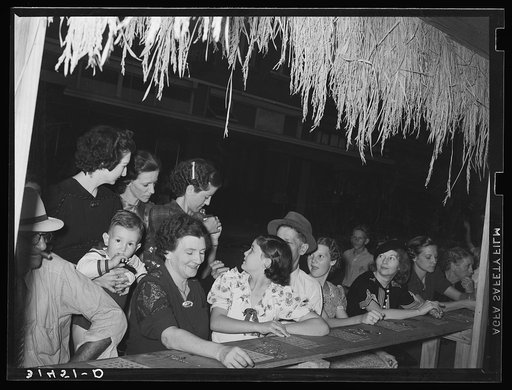 People at the National Rice Festival, waiting for the start of the game "beano." Crowley, Louisiana