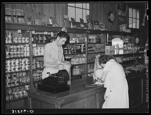 Untitled photo, possibly related to: Making a purchase in cooperative stores. Lake Dick Project, Arkansas
