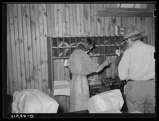 Getting the mail in cooperative store. Lake Dick, Arkansas