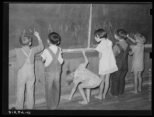 Children at the blackboard. Lake Dick Project, Arkansas