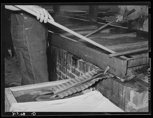 Finished sorghum pouring from vats. Lake Dick Project, Arkansas