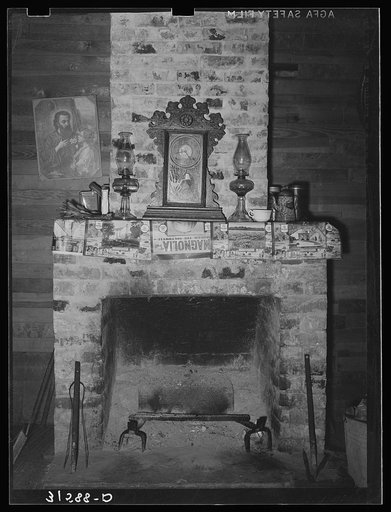 Fireplace in home of aged couple living twenty miles south of Crowley, Louisiana