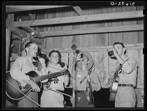 Cajun orchestra for fais-do-do near Crowley, Louisiana. Having intermission with drinks