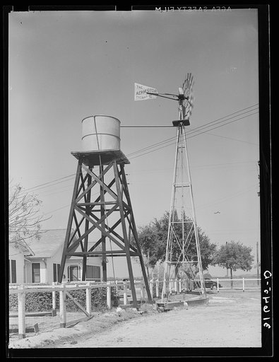 Windmill and water tower from which running water is available in home of Joseph La Blanc. Near Crowley, Louisiana