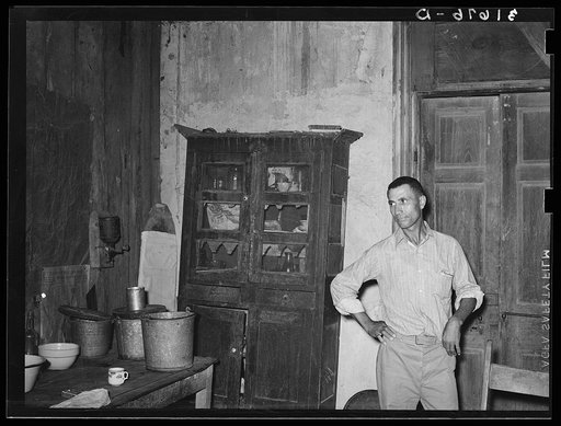 One room of old Trepagnier plantation house as it is today. This house is now occupied by Negroes. About 100 years ago this was the scene of an uprising on the part of Negro slaves. They were held off by M. Trepagnier until the arrival of military forces which decimated the ranks and paraded the hea